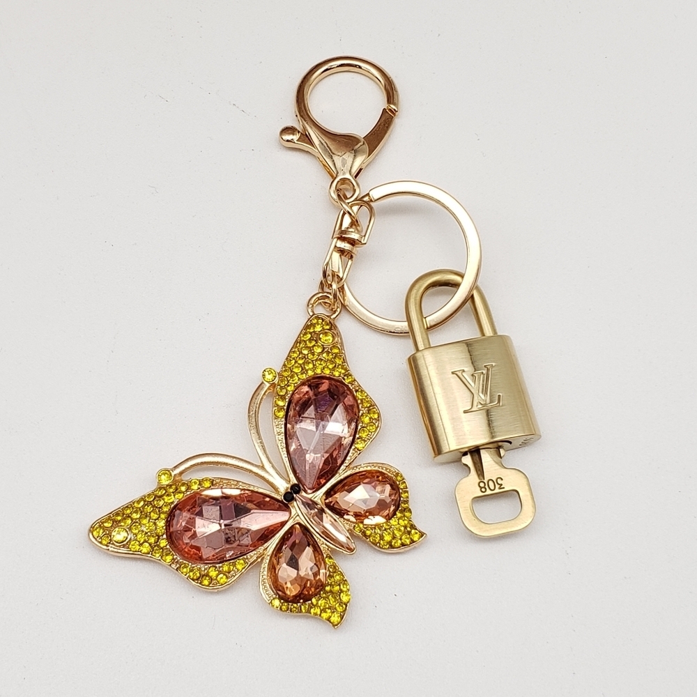 Authentic Louis Vuitton Gold Padlock W/ Unbranded Butterfly Bag Charm 100525